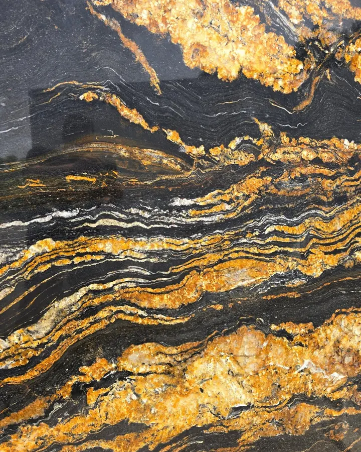 Black Tauros natural stone slab with gold and white veins